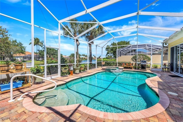 view of swimming pool featuring glass enclosure, grilling area, an in ground hot tub, and a patio