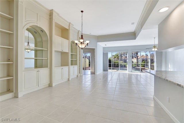 interior space with built in shelves, crown molding, light tile patterned floors, and ceiling fan with notable chandelier