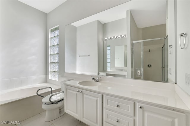 full bathroom with tile patterned flooring, vanity, separate shower and tub, and a wealth of natural light