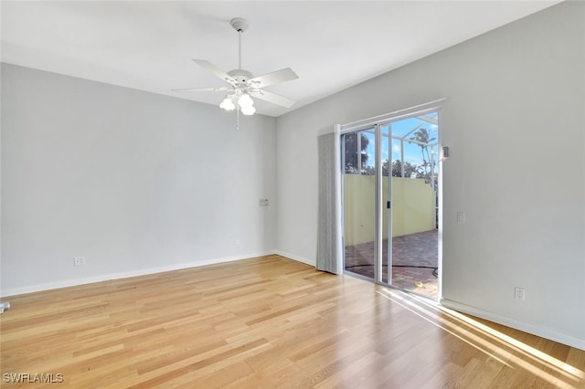 spare room featuring ceiling fan and light hardwood / wood-style floors