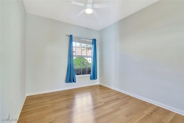 empty room with ceiling fan and light wood-type flooring