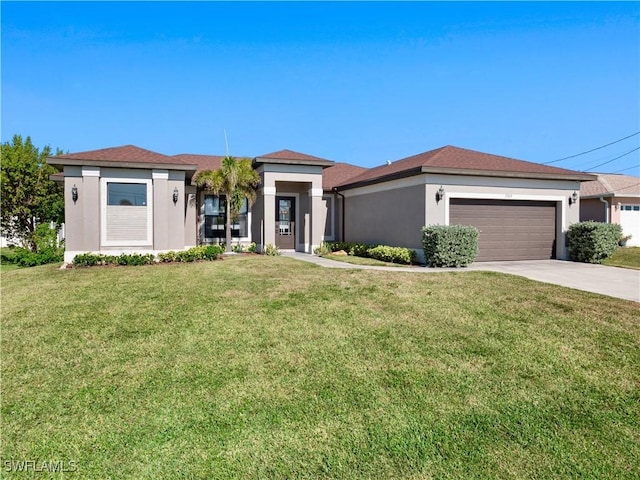 view of front of home with a front yard and a garage