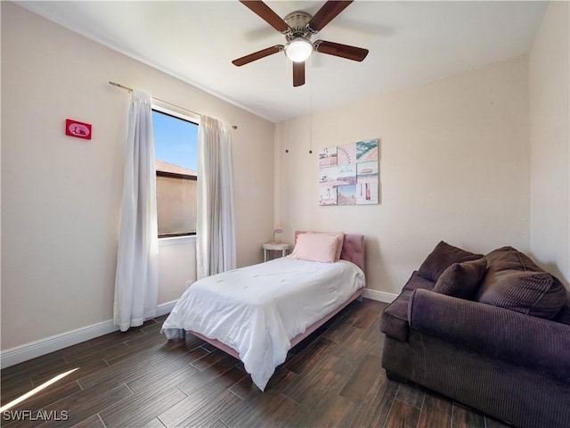 bedroom with ceiling fan and dark hardwood / wood-style floors