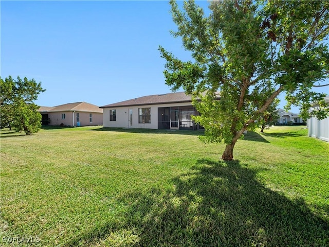 view of yard with a sunroom