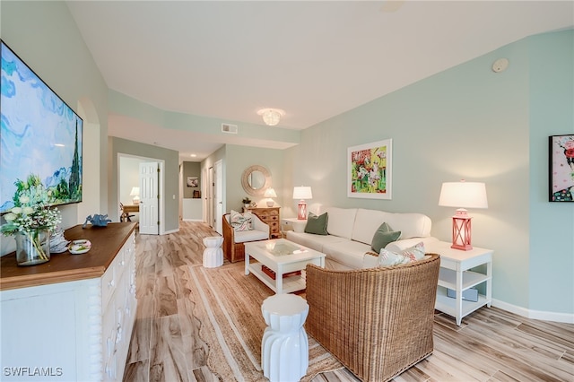 living room with light hardwood / wood-style flooring