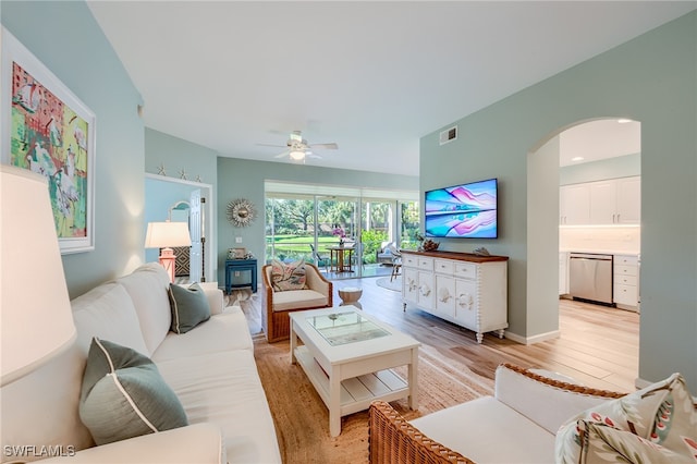 living room with light wood-type flooring and ceiling fan