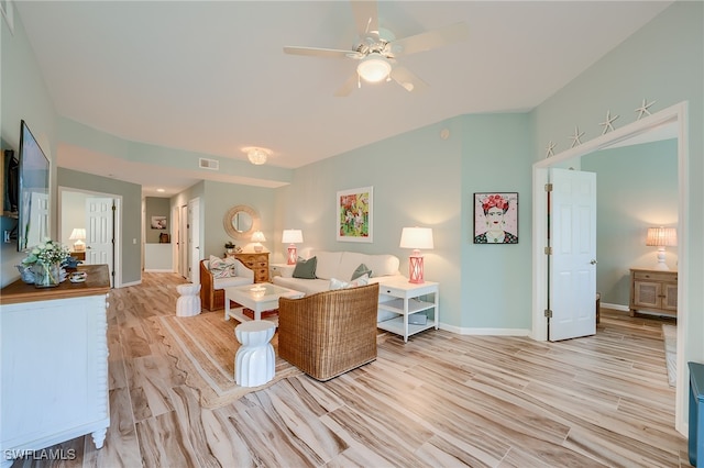 living room with ceiling fan and light wood-type flooring