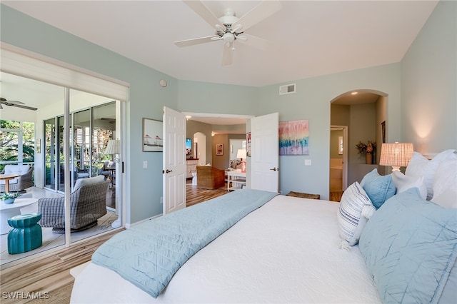 bedroom featuring hardwood / wood-style flooring, ceiling fan, and access to exterior