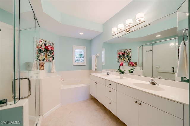 bathroom featuring tile patterned flooring, vanity, and plus walk in shower