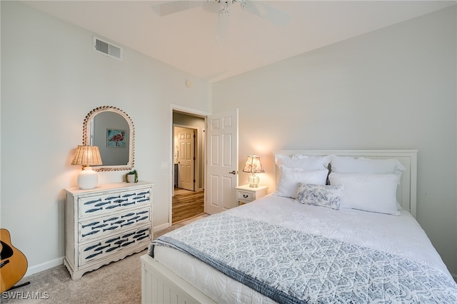 bedroom with ceiling fan and light carpet