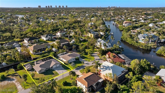 birds eye view of property featuring a water view