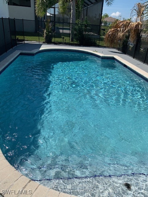 3026 SW 24th Ave, Cape Coral, FL 33914 - view of swimming pool featuring a lanai