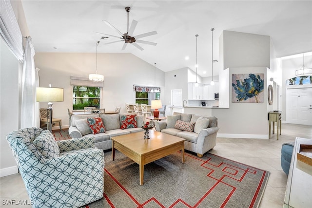 tiled living room with ceiling fan and high vaulted ceiling