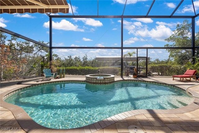 view of pool with a patio and an in ground hot tub