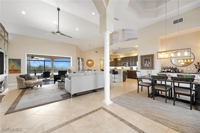 living room with decorative columns, recessed lighting, visible vents, a ceiling fan, and baseboards