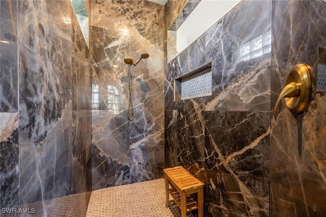 bathroom with tiled shower