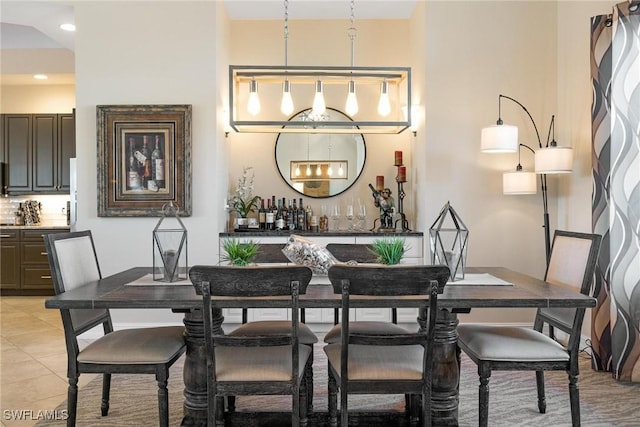 dining space featuring light tile patterned flooring