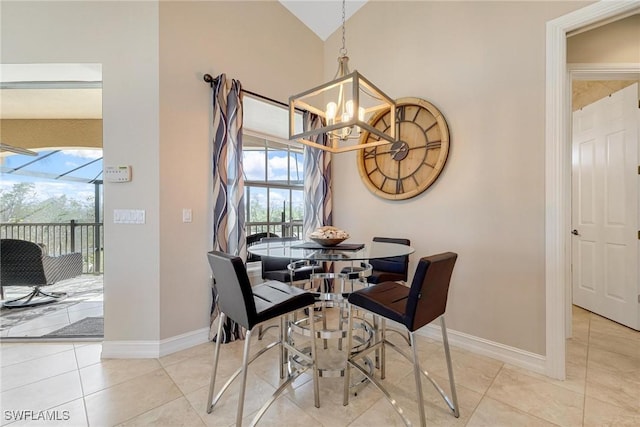 dining room featuring light tile patterned floors, baseboards, vaulted ceiling, and a notable chandelier