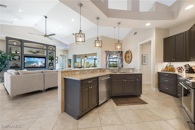 kitchen with appliances with stainless steel finishes, backsplash, decorative light fixtures, dark brown cabinets, and sink