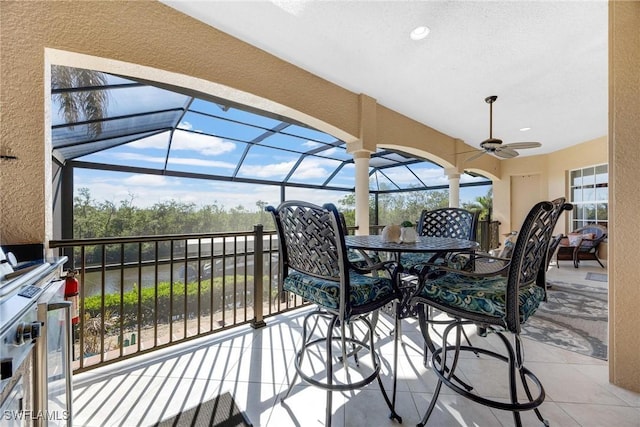 view of patio / terrace with a lanai and ceiling fan