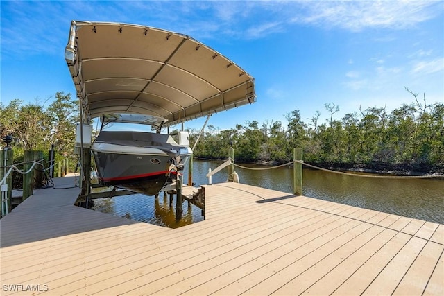 dock area featuring a water view and boat lift