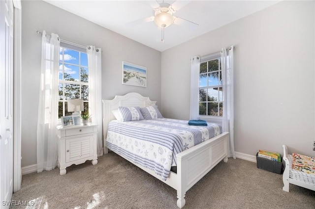 bedroom with carpet floors, ceiling fan, and baseboards