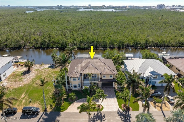 birds eye view of property with a water view