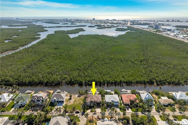 drone / aerial view featuring a residential view and a water view