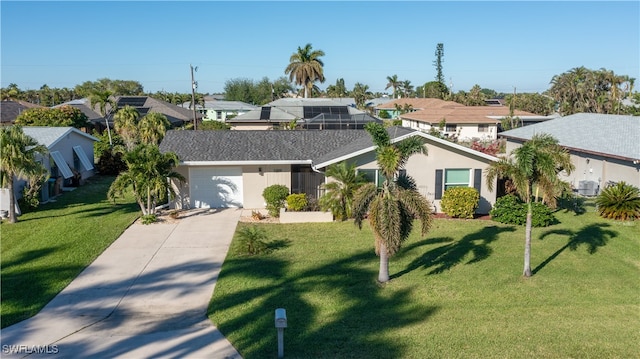 view of front of house featuring a garage, a front yard, and central AC