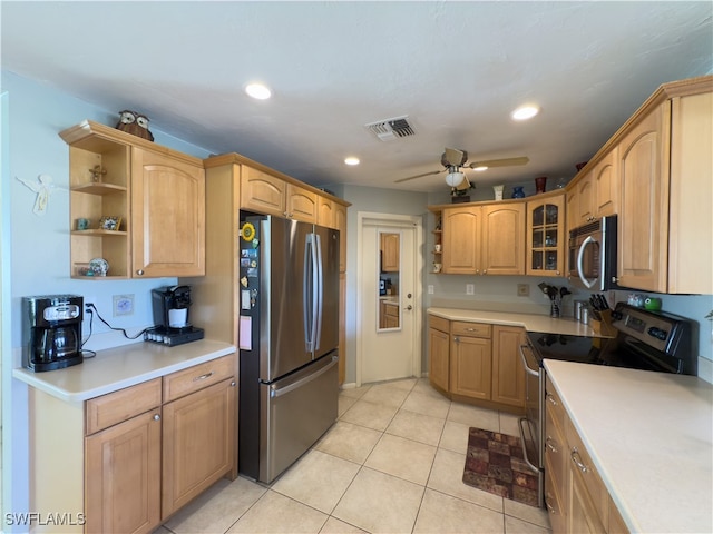 kitchen featuring ceiling fan, light brown cabinets, light tile patterned floors, and appliances with stainless steel finishes