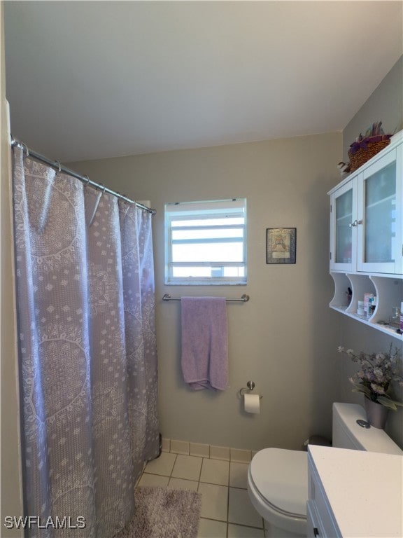 bathroom with tile patterned floors, vanity, and toilet