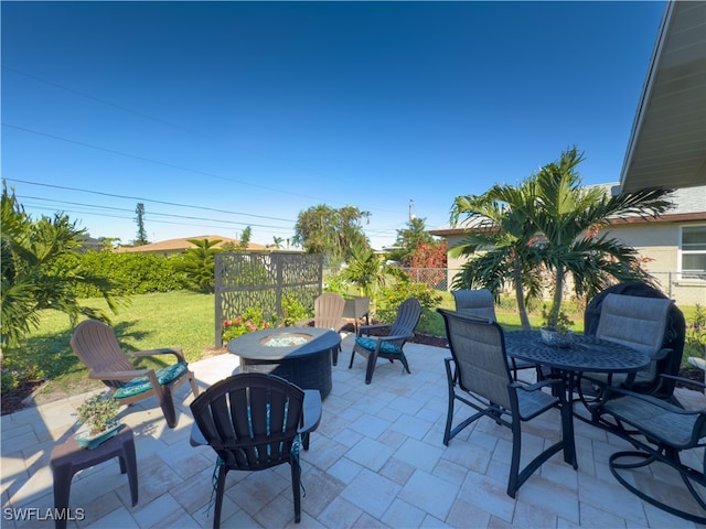 view of patio / terrace featuring an outdoor fire pit