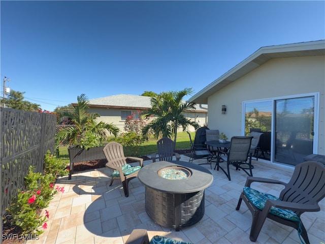 view of patio / terrace with an outdoor fire pit