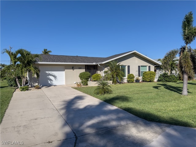 ranch-style home featuring a garage and a front lawn