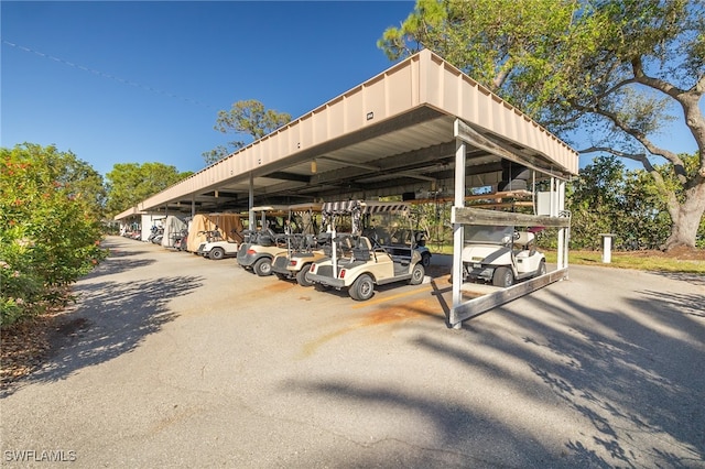 view of parking / parking lot with a carport