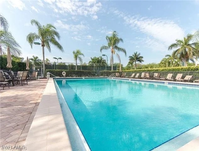 view of swimming pool with a patio