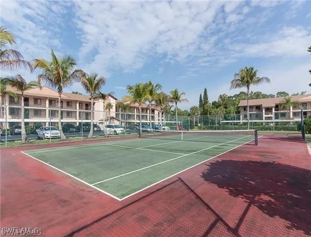 view of sport court with basketball hoop