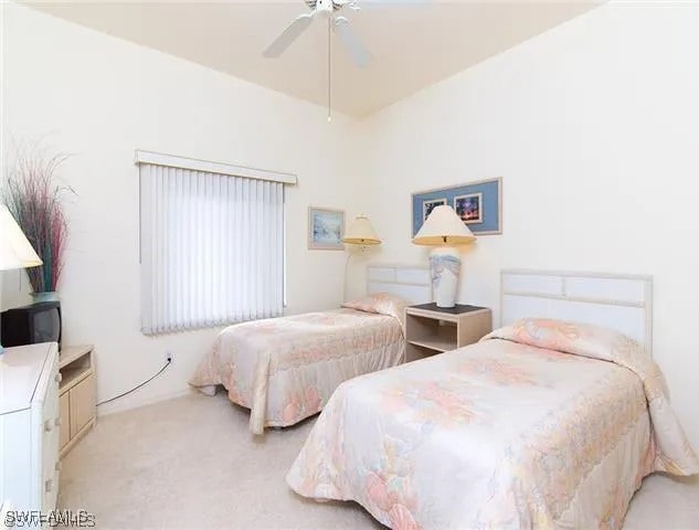 carpeted bedroom with ceiling fan