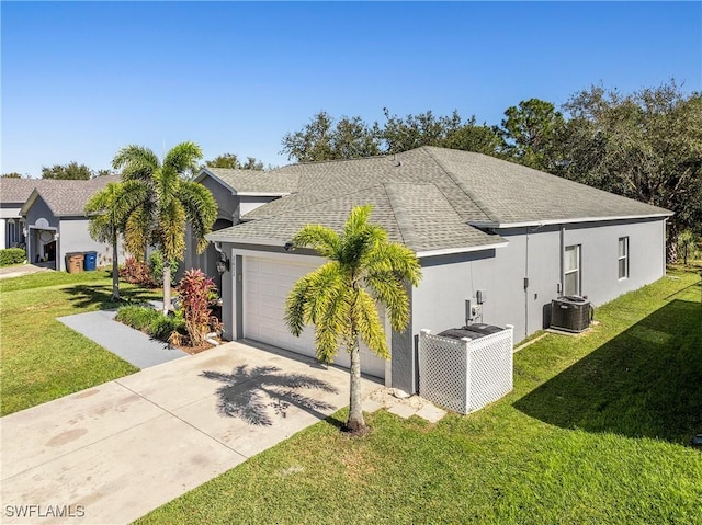 view of property exterior with a lawn, cooling unit, and a garage