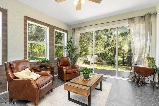 sunroom / solarium with ceiling fan