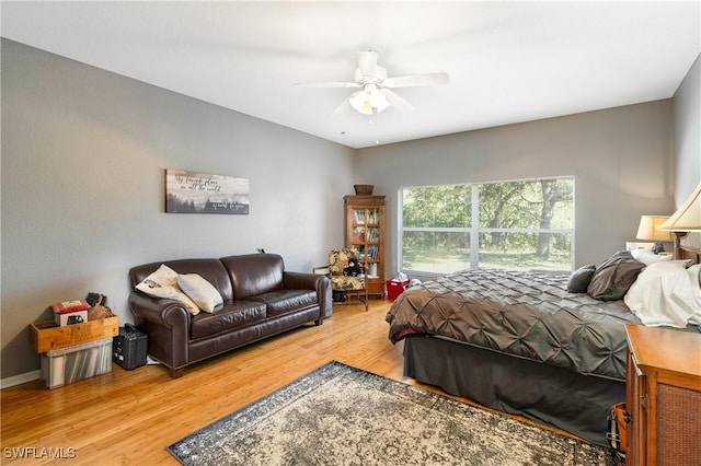 bedroom with ceiling fan and wood-type flooring