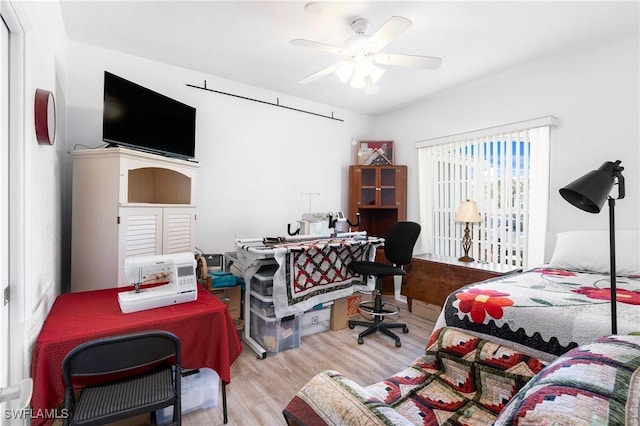 bedroom with light wood-type flooring and ceiling fan