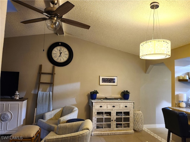 tiled living room with ceiling fan, lofted ceiling, and a textured ceiling