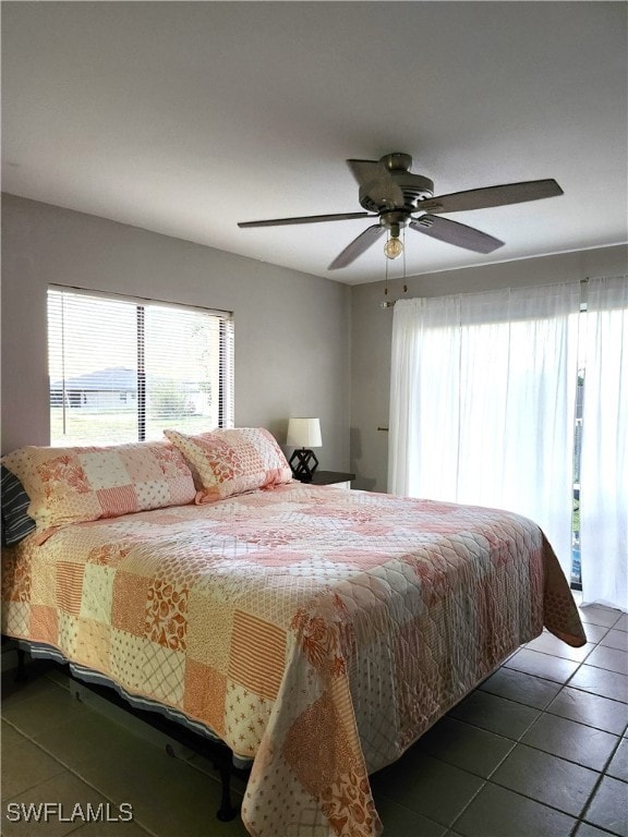 tiled bedroom with ceiling fan