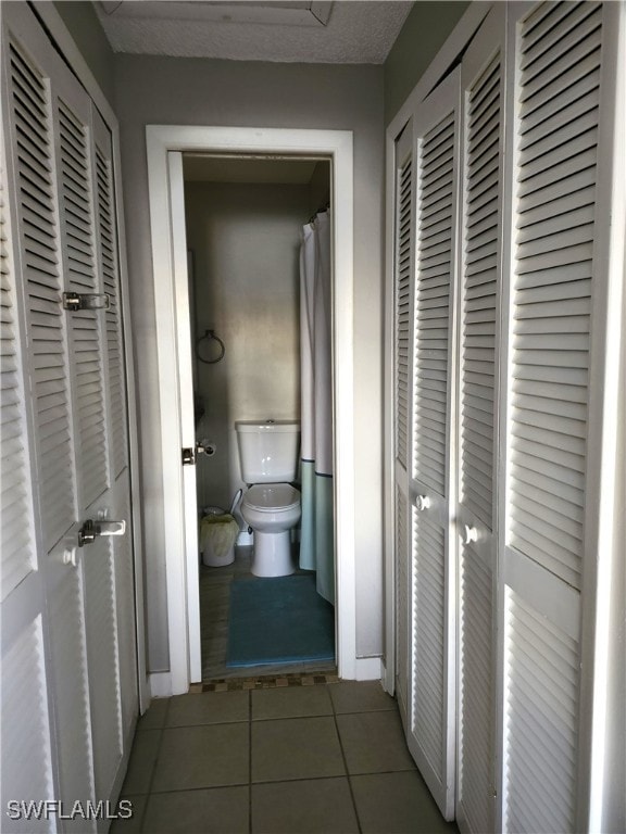 corridor featuring tile patterned floors