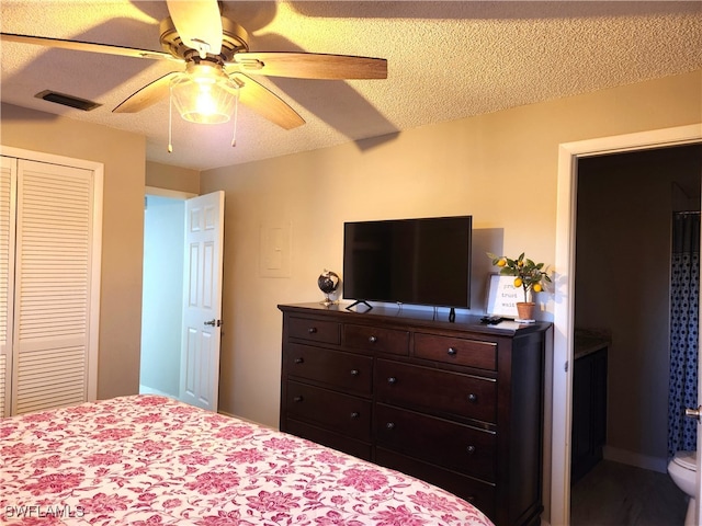 bedroom featuring a textured ceiling, a closet, and ceiling fan