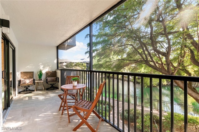 balcony featuring a water view