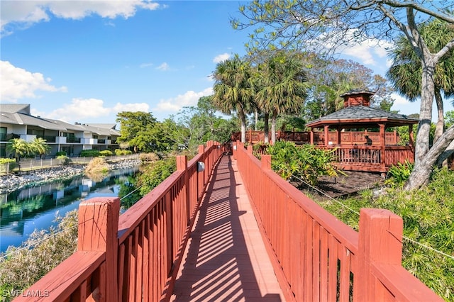 view of community featuring a gazebo and a water view