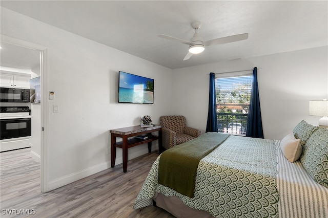 bedroom with ceiling fan and light hardwood / wood-style flooring