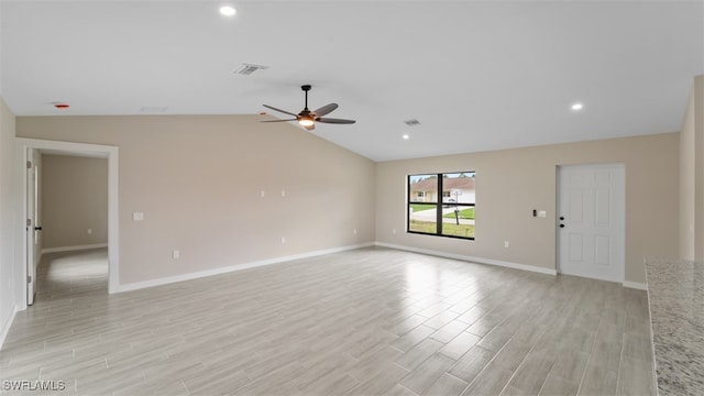 unfurnished room with light hardwood / wood-style flooring, ceiling fan, and lofted ceiling